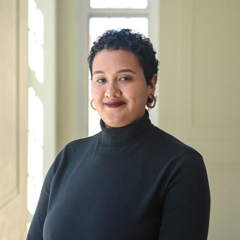 Adrian Cato (She/They) Headshot